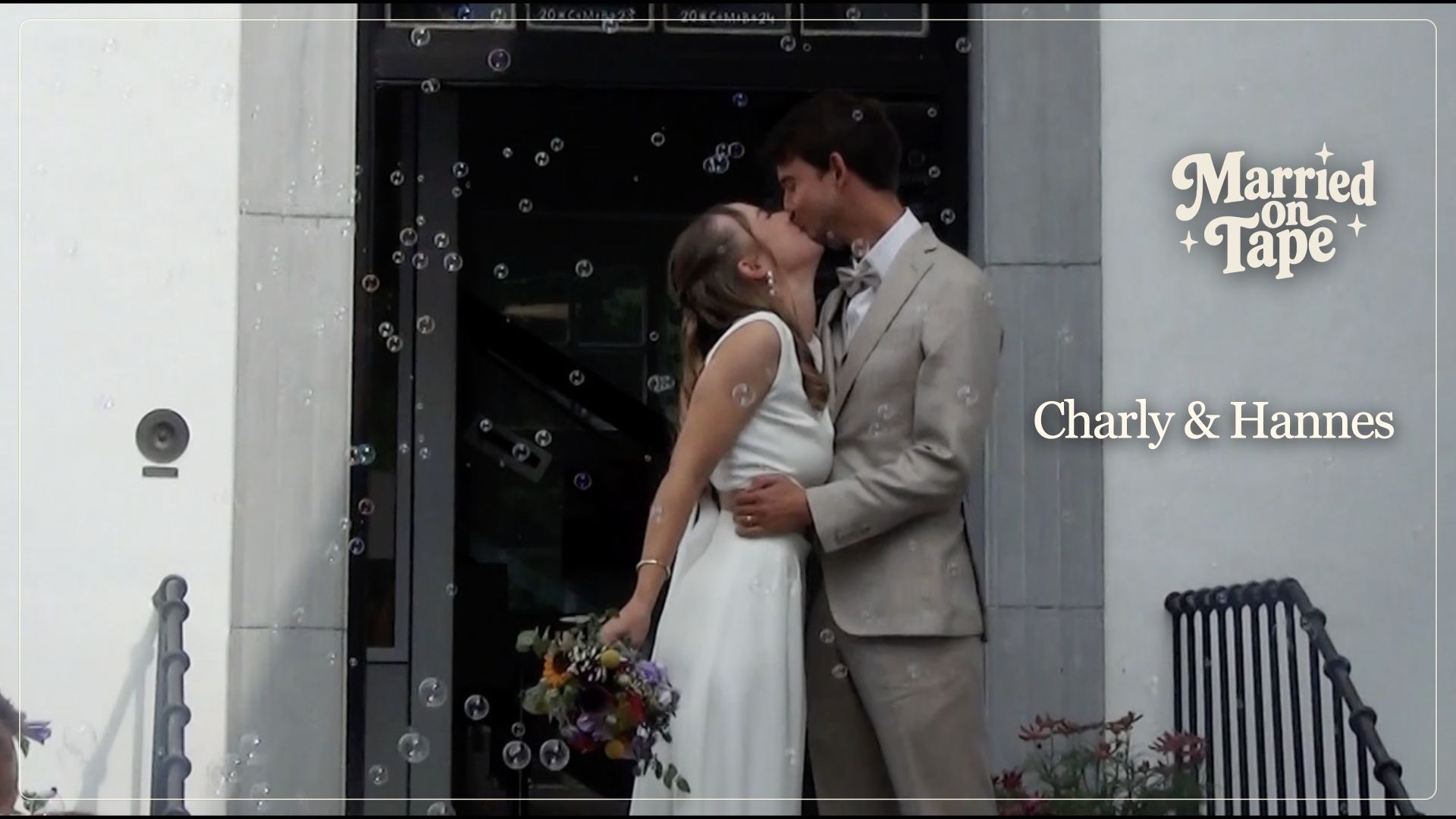 Charly and Hannes kiss after their ceremony as soap bubbles float around them